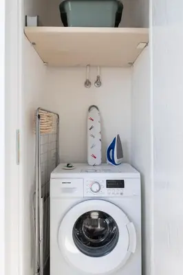 a washer and dryer in a small room at Top Floor Stunning Acropolis View in Athens