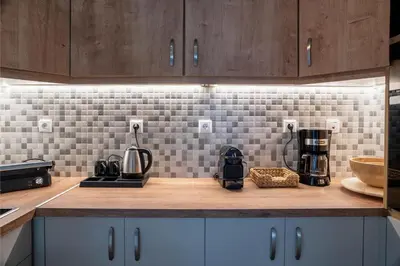 a kitchen with a counter top with a coffee maker on it at Acropolis Penthouse Project in Athens