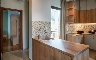 a kitchen with a sink and a counter top at Acropolis Penthouse Project in Athens
