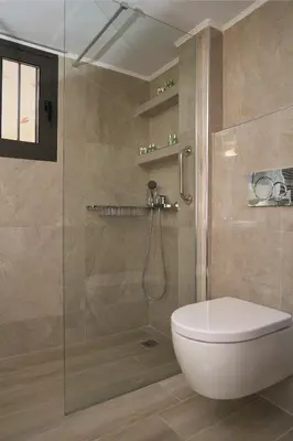 a bathroom with a shower with a toilet and a sink at Acropolis Penthouse Project in Athens