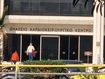 a man walking outside of a building at SYGGROU - ONASSIO and REA Hospitals - 1bdr APT - sleep 2-4p in Athens