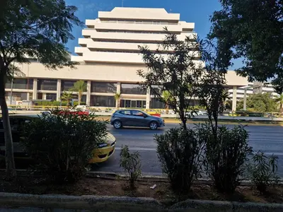a car parked in a parking lot in front of a building at SYGGROU - ONASSIO and REA Hospitals - 1bdr APT - sleep 2-4p in Athens
