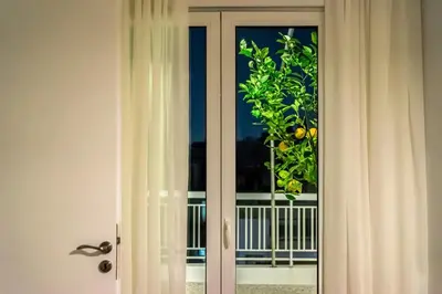 a sliding glass door with a view of a balcony at Ariston!Μικρο ρετιρέ στο Θησείο in Athens