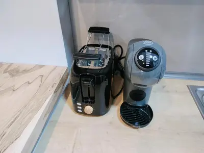 a coffee maker sitting on a counter next to a mixer at MYKALI's COZY APARTMENT in Athens
