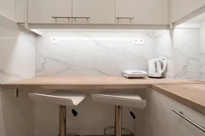 a kitchen with a counter top with a toaster on it at City Center Balcony Escape in Athens