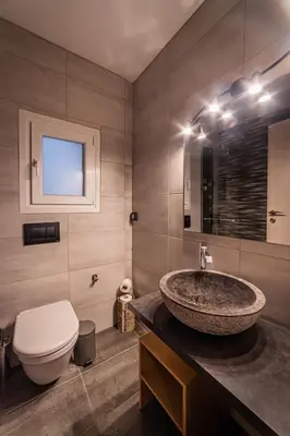 a bathroom with a sink and a toilet at Athenian Heaven in Athens