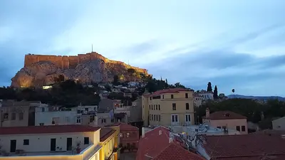 a view of a city with a castle on a mountain at Spacious apartment near Acropolis in Athens