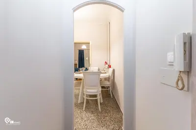 a dining room with a table and a mirror at Sophocles - Central Athenian Cozy Retreat in Athens