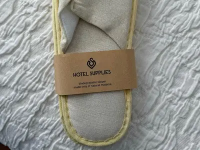 a hotel supplies bag with a tag on a bed at TH0 Luxury two bedrooms Apartments with High-Tech Amenities in Athens