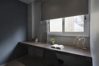 a desk in a room with a window and a chair at Renovated 3BDR Apartment in the heart of Athens in Athens