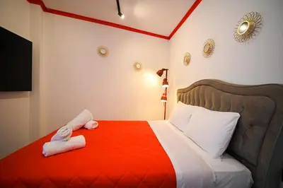 a bedroom with a bed with towels on it at Plaka Suite Next to Acropolis by Zeus Suites in Athens
