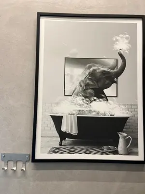 a picture of an elephant in a bath tub at Muses Suite Klathmonos by Zeussuites in Athens