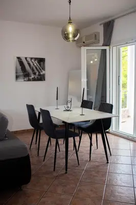 a dining room with a table and chairs at EMVI APARTMENTS VI near airport in Vravrona