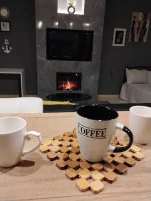 two cups of coffee sitting on a table with hearts at Elegant Minimalistic Downtown Apartment! in Athens
