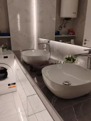 a bathroom with a sink and a washing machine at Elegant Minimalistic Downtown Apartment! in Athens