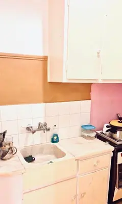 a kitchen with a sink and a stove at Quiet Arty Cosy Cool Flat Downtown in Athens