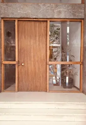 a front door of a building with a window at Quiet Arty Cosy Cool Flat Downtown in Athens