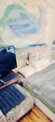 a camera sitting on top of a book at Quiet Arty Cosy Cool Flat Downtown in Athens