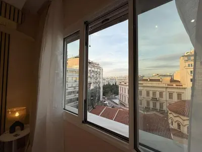 a window with a view of a city at Heart of Athens, right next to Syntagma Square in Athens