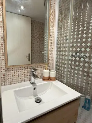 a bathroom with a white sink and a mirror at Heart of Athens, right next to Syntagma Square in Athens