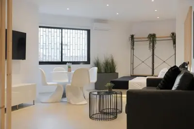 a living room with a couch and a table at Syntagma Serenity Suites in Athens