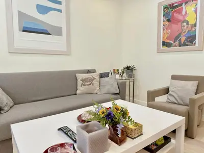 a living room with a couch and a table at Elegant apartment in Kolonaki in Athens