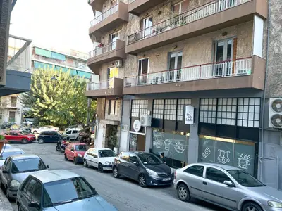 a group of cars parked on the side of a building at Eva's House - 2 Bedroom Apartment in Athens