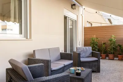 two chairs and a table on a patio at Bright Apartment in Athens City Center 2 Bedrooms with Terrace in Athens