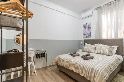 a bedroom with a bed with two teddy bears on it at Bright Apartment in Athens City Center 2 Bedrooms with Terrace in Athens