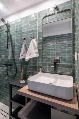 a bathroom with a white tub and a mirror at Glyfada Center Seaview Two Bedrooms in Athens