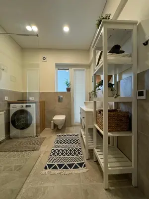 a bathroom with a sink and a toilet in a room at Martino apartment in Athens