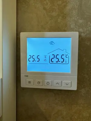 a clock on the wall of a room at Martino apartment in Athens