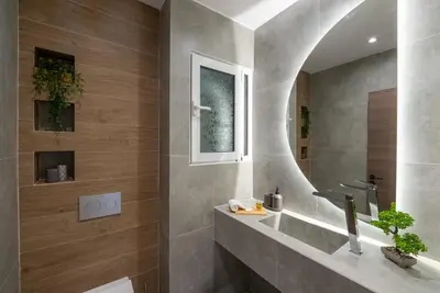 a bathroom with a sink and a mirror at Central 2 Bdrm Aprt In Koukaki! in Athens