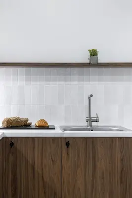 a kitchen counter with a sink and a plate of bread at MoRe by Zoia Living in Athens