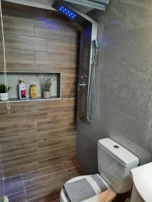 a bathroom with a shower and a toilet in it at Athens Ellinikon Apartment in Athens