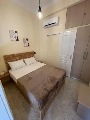 a bedroom with a large bed in a room at Athens Ellinikon Apartment in Athens