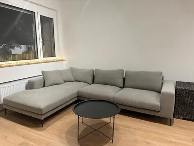 a living room with a couch and a table at YPSILON Apartment in Athens