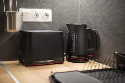 a coffee maker and a toaster on a counter at Althea Luxury Apt City View, Walk to Acropolis in Athens