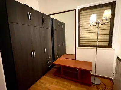 a locker room with a table and some cabinets at Konstantinia comfort studio in Athens