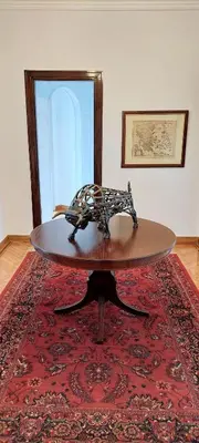 a sculpture of a horse on a table on a rug at Grand suite in the temple of Zeus in Athens
