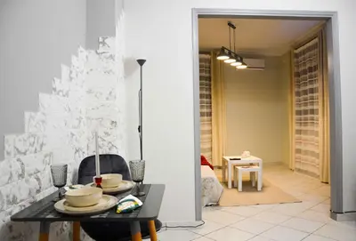 a dining room with a table and a christmas tree at Athens Boutique Home in Athens