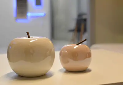 two apples sitting on top of a table at Athens Boutique Home in Athens
