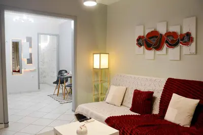 a living room with a couch and a table at Athens Boutique Home in Athens