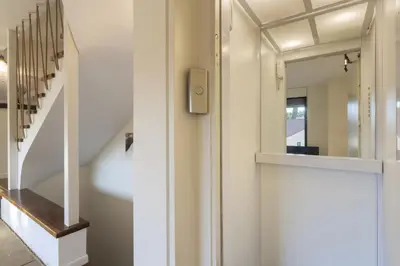 a hallway with a mirror and a staircase at Spacious 3bdr Apartment with Monumental View in Athens
