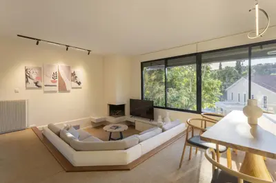 a living room with a couch and a table at Spacious 3bdr Apartment with Monumental View in Athens