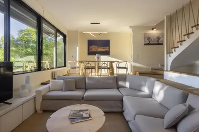 a living room with a couch and a table at Spacious 3bdr Apartment with Monumental View in Athens