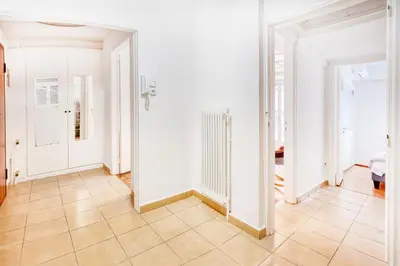 an empty room with white walls and a tile floor at Syntagma Apartment in Athens