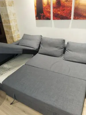 two beds in a room with paintings on the wall at Luxury stay near the Acropolis 10-min walk to history! in Athens