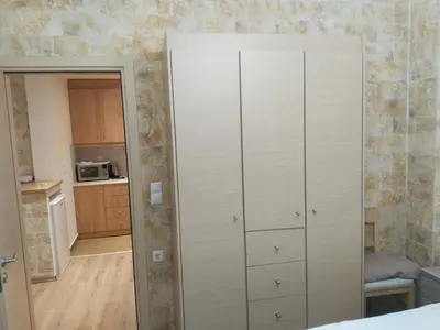 a large closet in a room with a kitchen at Luxury stay near the Acropolis 10-min walk to history! in Athens