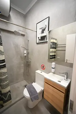 a bathroom with a sink and a toilet and a shower at Iris suite Stadiou by Zeussuites in Athens